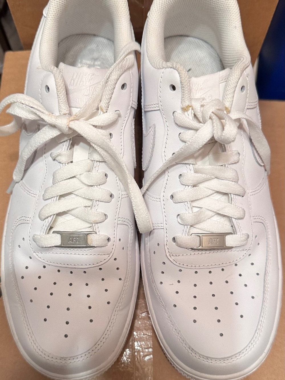 Nike Air Force 1 '07 sneakers, featuring a low-top design, classic white color